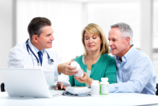 Elderly couple talking to a pharmacist